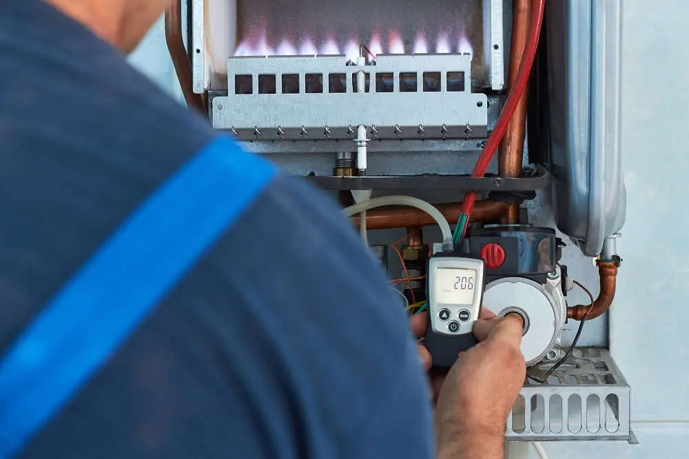 Close-up of modern HVAC tools used by technician during furnace maintenance