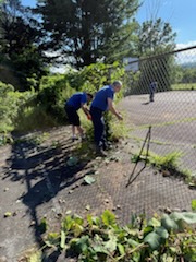 Spall volunteers working across the park grounds.