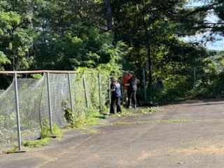 The Spall crew working on the park basketball court.
